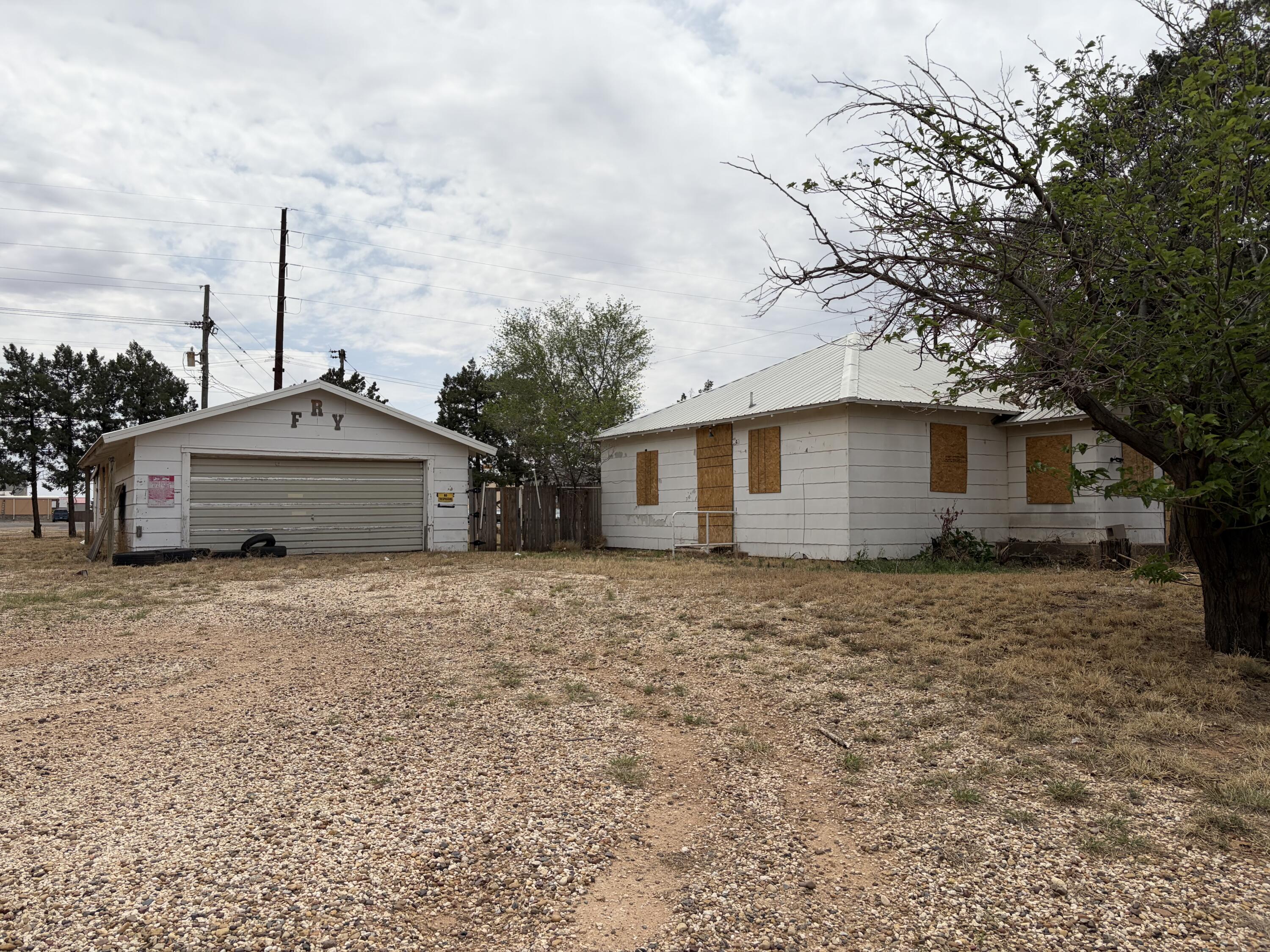 709 81st Street Lubbock, TX 79404 - Photo 3 of 3 a backyard of a house with large trees