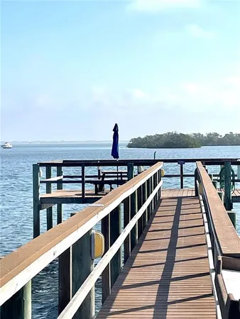 a view of a terrace with wooden floor and outdoor seating