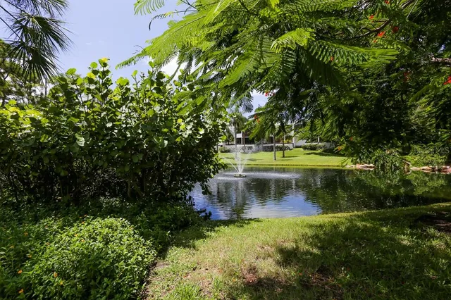 a view of a swimming pool and outside seating area