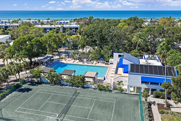 a view of a swimming pool and a yard