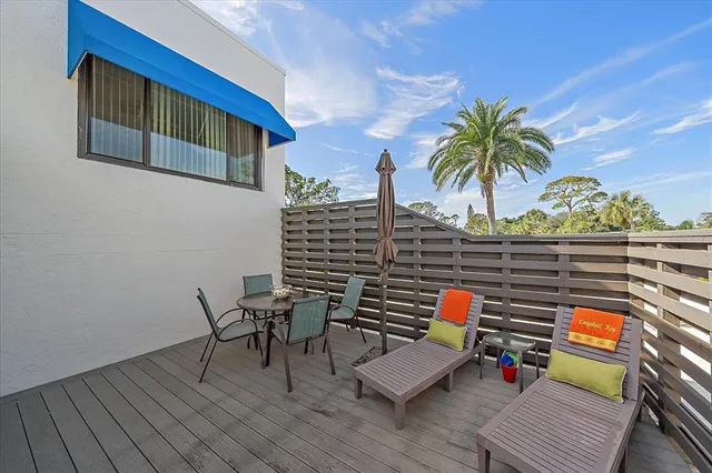 a reading room with furniture and wooden floor