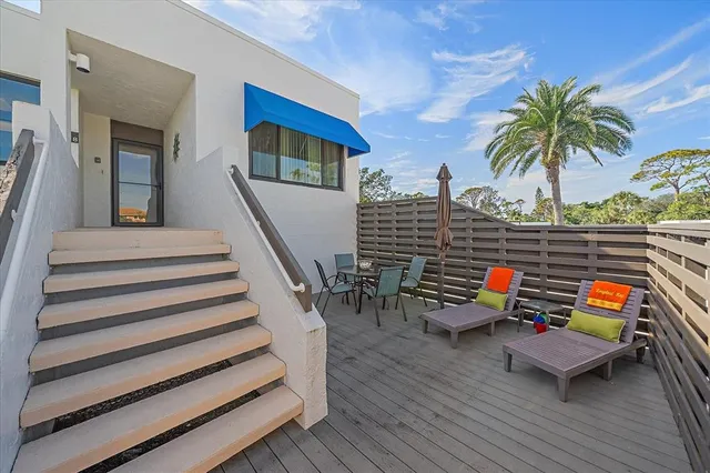 a kitchen with granite countertop white cabinets sink and stainless steel appliances
