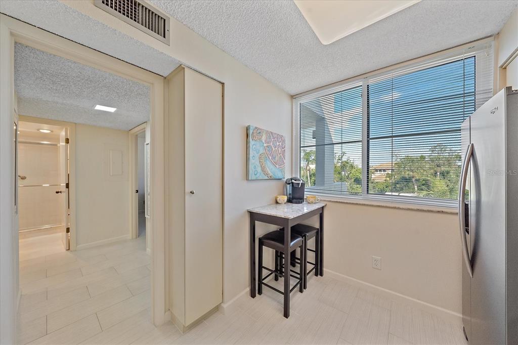 618 Bayport Way, Unit 618 Longboat Key, FL 34228 - Photo 10 of 47 a view of a room that has a bench in it
