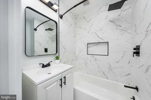 a bathroom with a sink and a bathtub