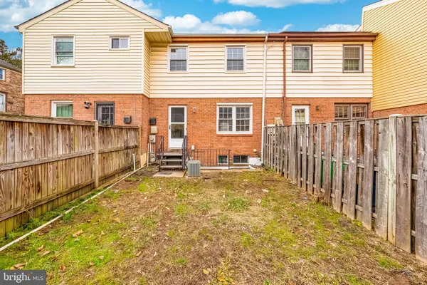 a bathroom with a sink toilet and a mirror