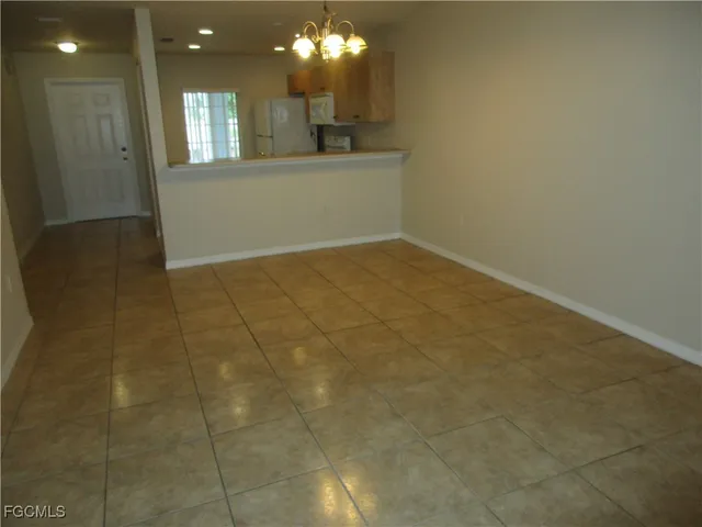 a view of a hallway with a window