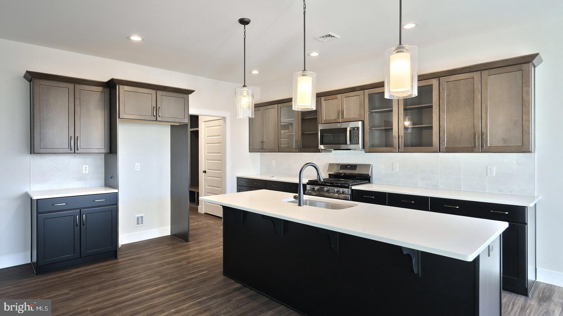 475 Pinnacle Rdg Drive Annville, PA 17003 - Photo 17 of 31 a kitchen with stainless steel appliances a sink a stove a refrigerator a center island and wooden floor