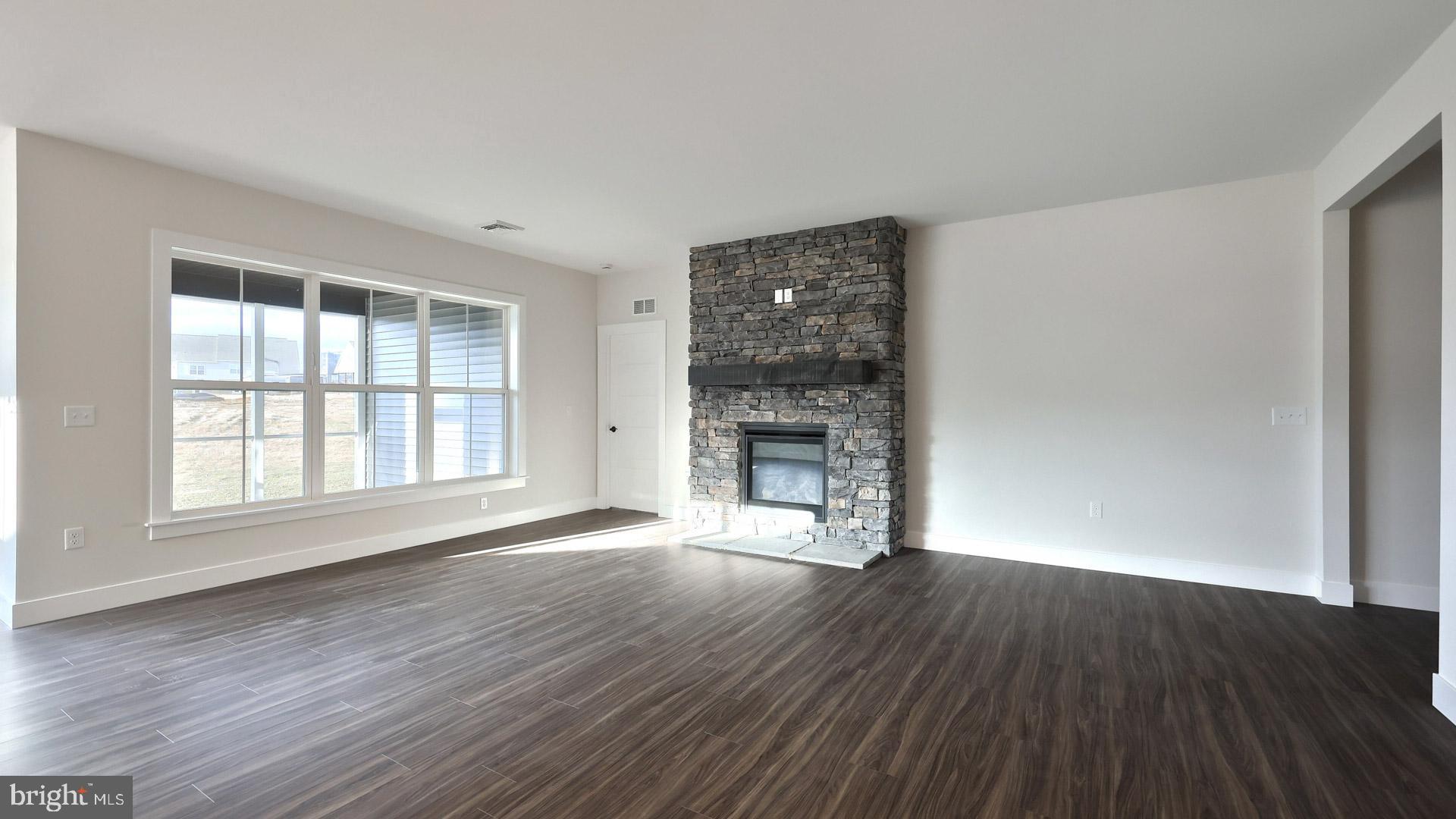 475 Pinnacle Rdg Drive Annville, PA 17003 - Photo 23 of 31 an empty room with wooden floor fireplace and windows
