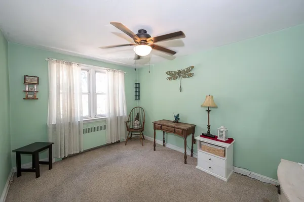 a bedroom with furniture and a window