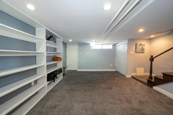 a view of a room with air conditioner and window