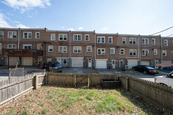 a view of a house with pool and sitting area