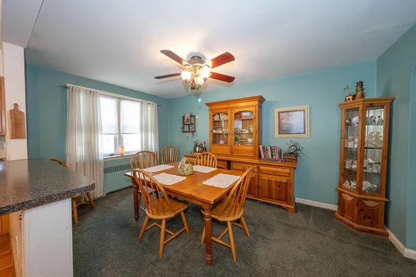 a dining room with furniture and window