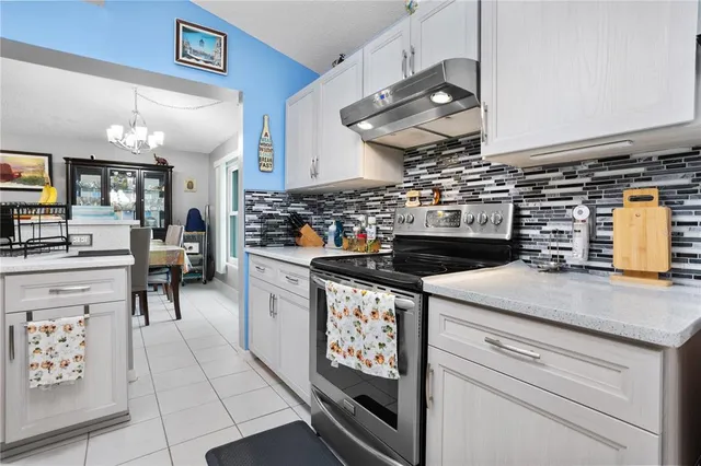 a kitchen with a stove and a cabinets