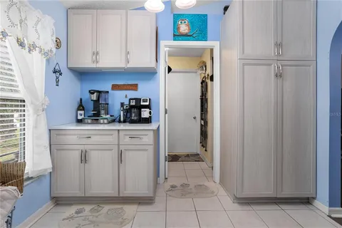 a kitchen with stainless steel appliances a refrigerator and cabinets