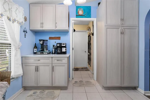 a kitchen with stainless steel appliances a refrigerator and cabinets