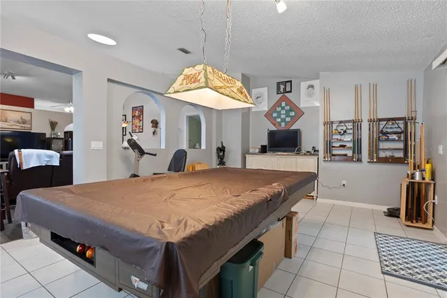 a living room with a table and chairs