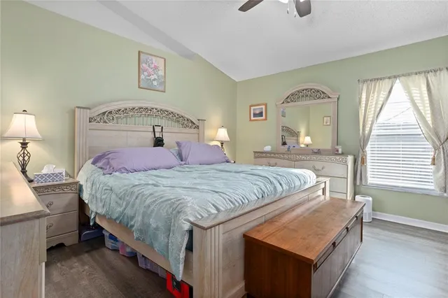 a bedroom with a bed and a dresser