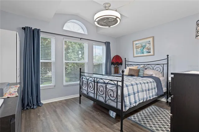 a bathroom with a sink and mirror with toilet