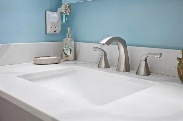 a bedroom with bed and furniture