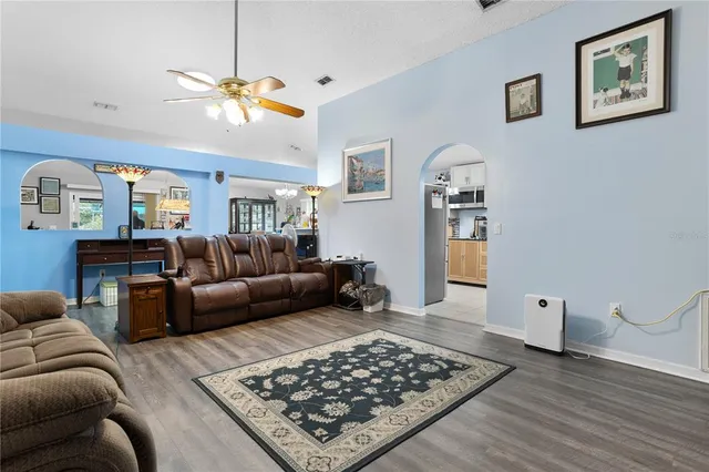 a living room with furniture and a rug