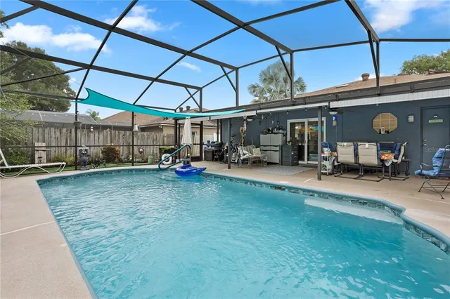 a view of a chair and table in the garden