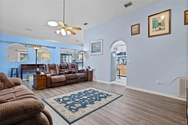 a living room with furniture rug and window