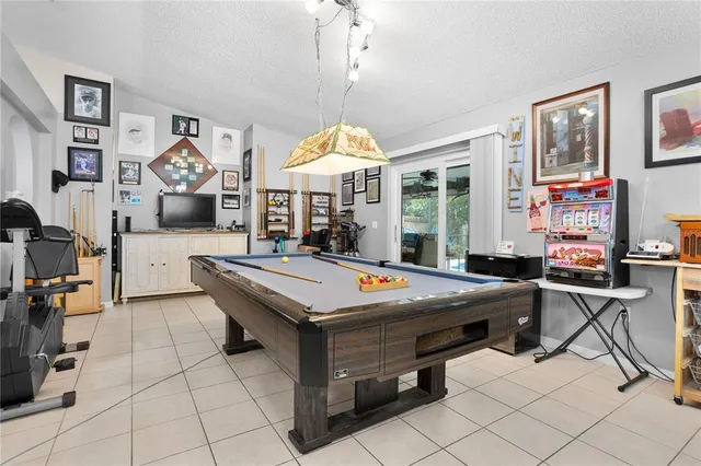 a living room with furniture a rug and a chandelier