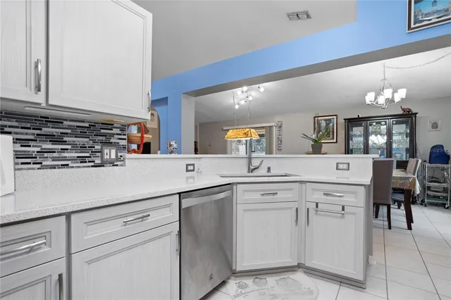a kitchen with appliances cabinets and a sink