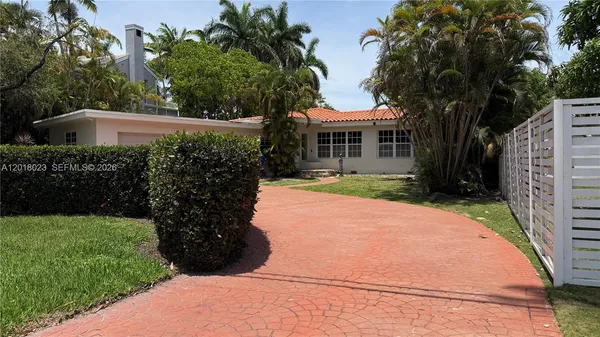 a view of house with garden space and trees