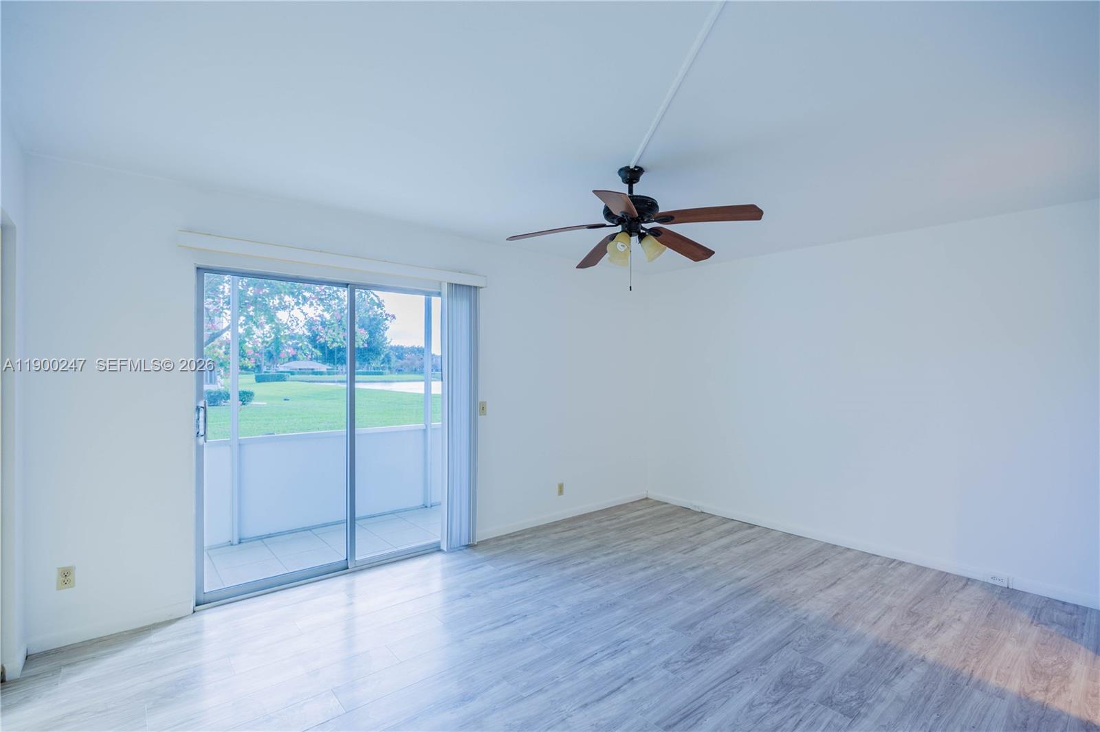 303 Preston H, Unit 303 Boca Raton, FL 33434 - Photo 16 of 50 a view of a room with wooden floor