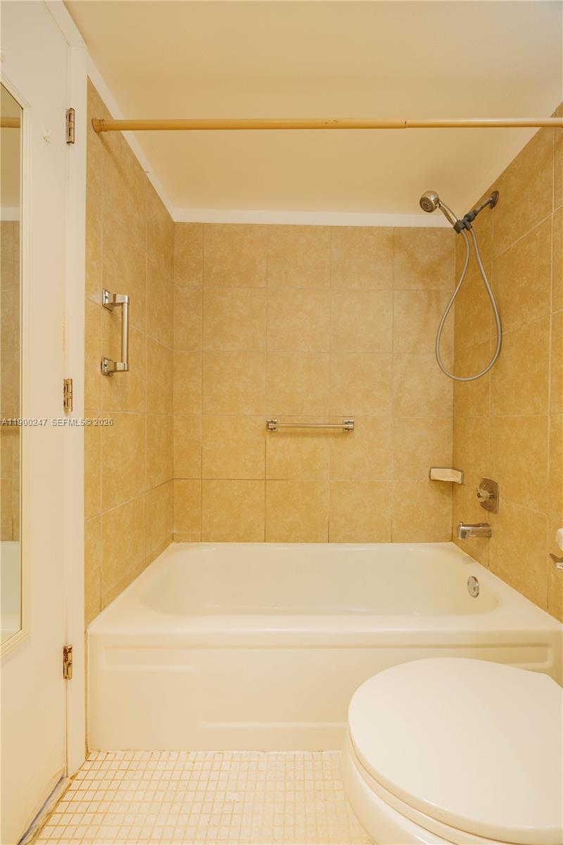 303 Preston H, Unit 303 Boca Raton, FL 33434 - Photo 22 of 50 a bathroom with a bathtub and a shower