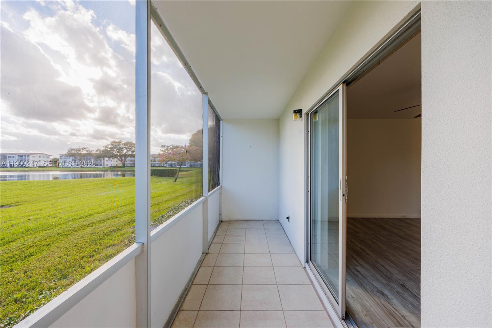 303 Preston H, Unit 303 Boca Raton, FL 33434 - Photo 26 of 50 a view of an empty room and outdoor space