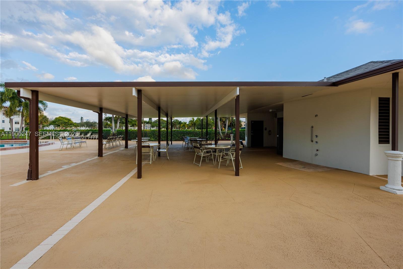 303 Preston H, Unit 303 Boca Raton, FL 33434 - Photo 36 of 50 a view of a patio with a backyard