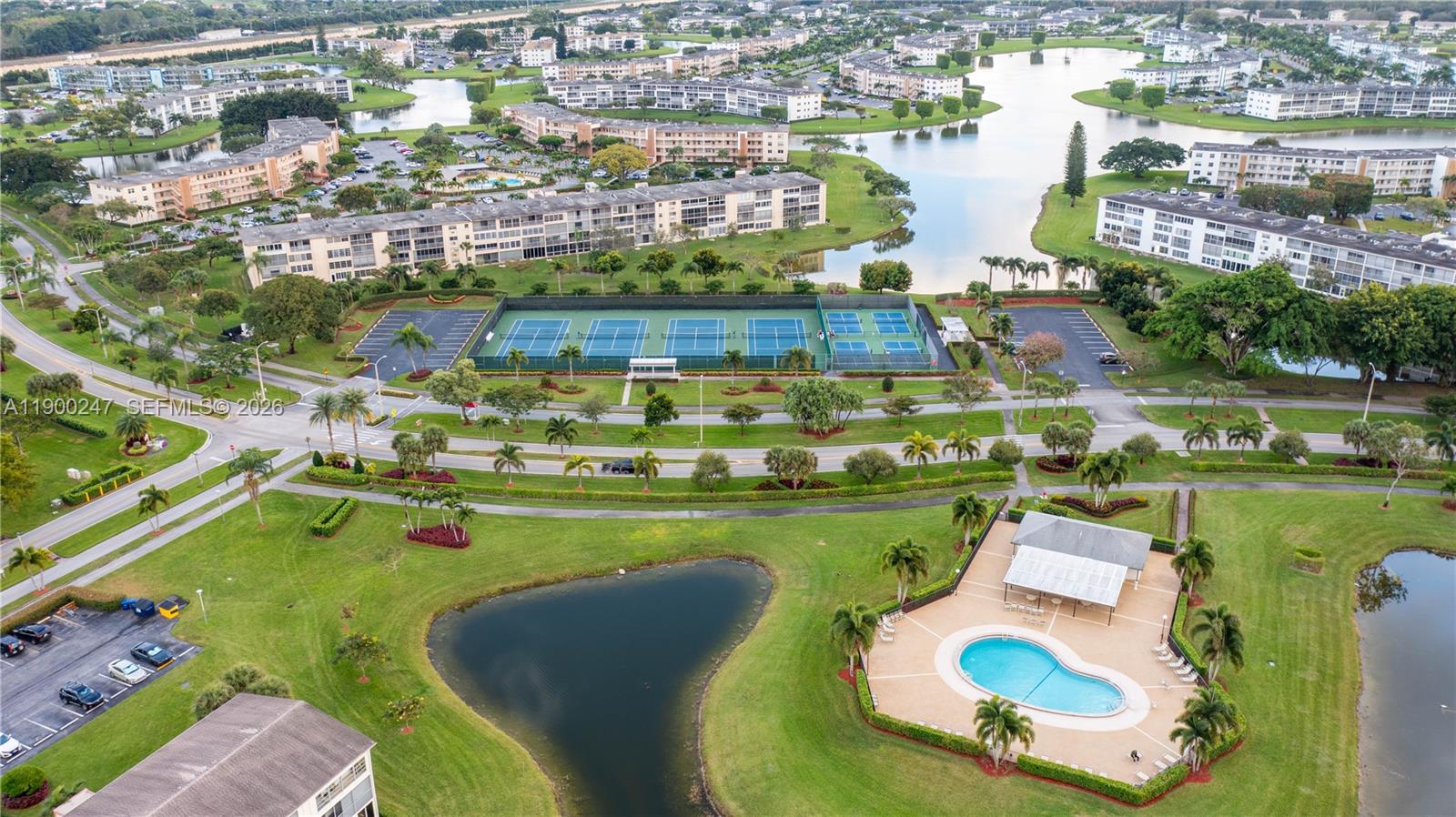 303 Preston H, Unit 303 Boca Raton, FL 33434 - Photo 38 of 50 a view of a lake with a city