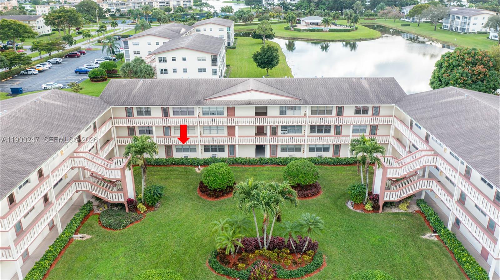303 Preston H, Unit 303 Boca Raton, FL 33434 - Photo 42 of 50 an aerial view of a house with a yard basket ball court and outdoor seating
