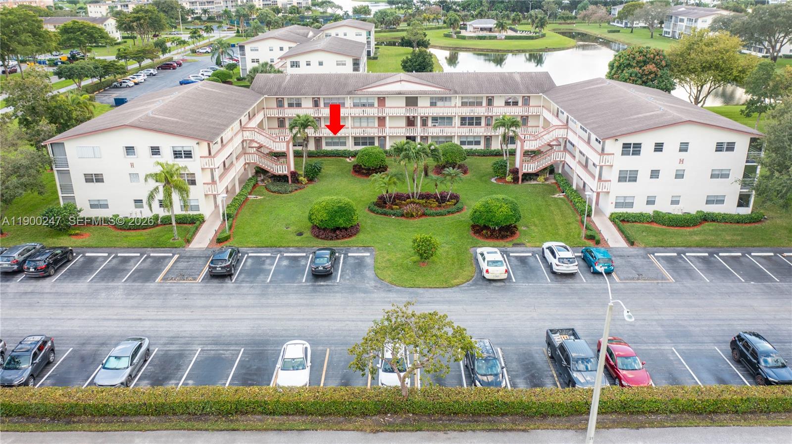 303 Preston H, Unit 303 Boca Raton, FL 33434 - Photo 43 of 50 an aerial view of residential houses with outdoor space and parking