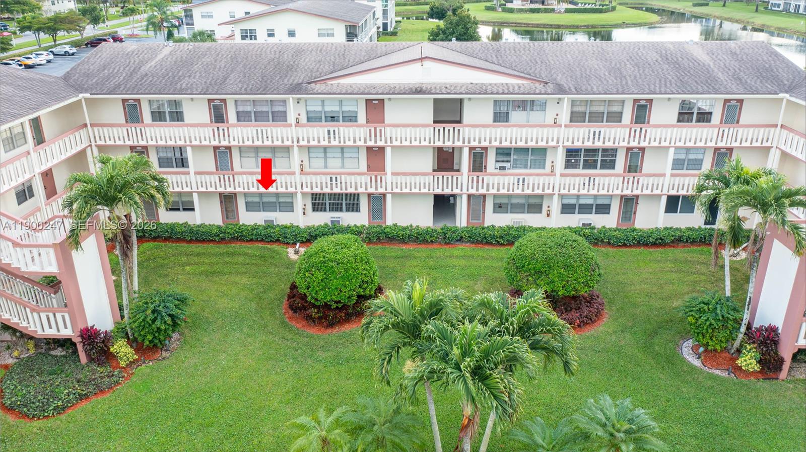 303 Preston H, Unit 303 Boca Raton, FL 33434 - Photo 44 of 50 a aerial view of a house with swimming pool and garden