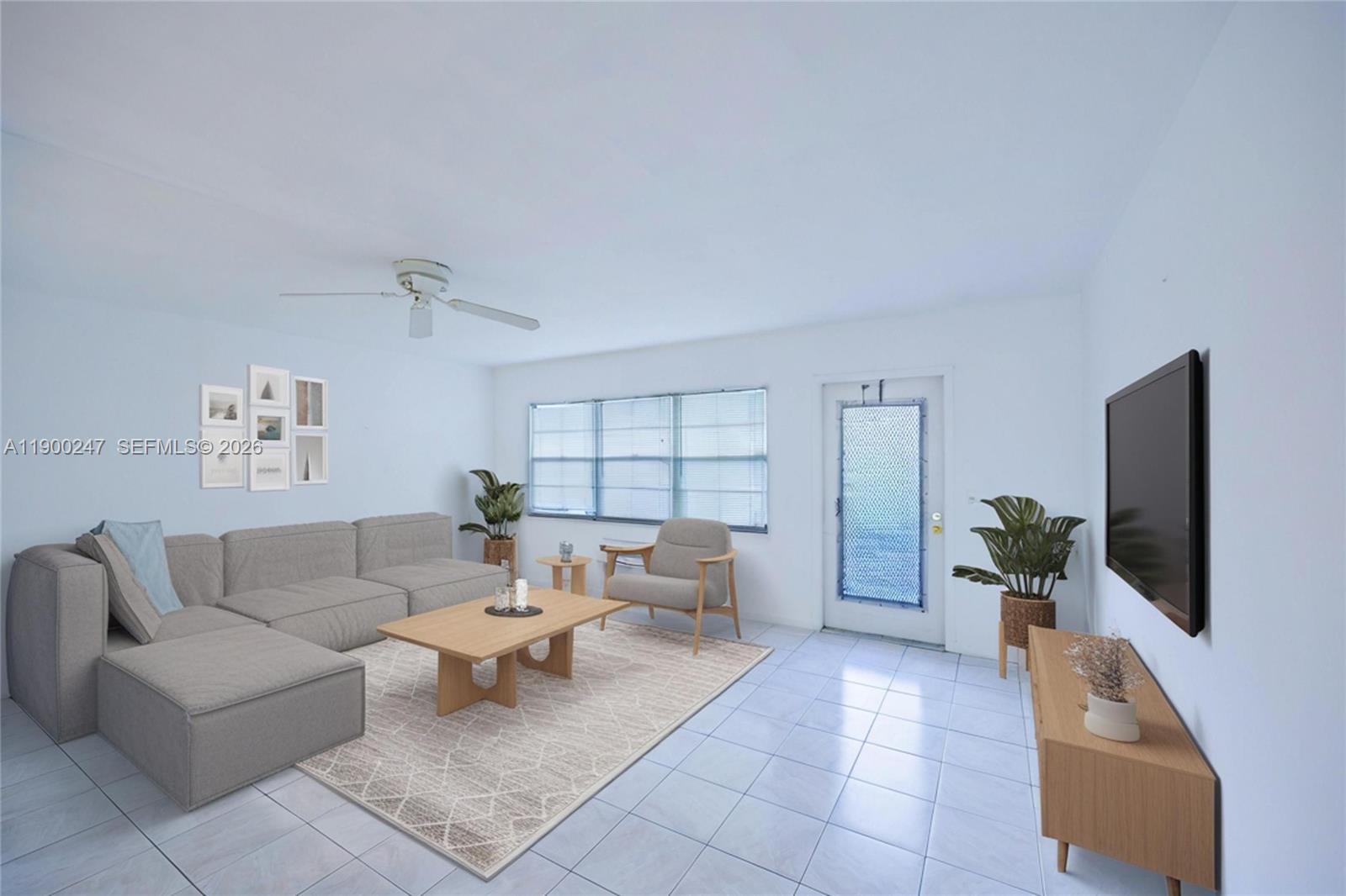 303 Preston H, Unit 303 Boca Raton, FL 33434 - Photo 50 of 50 a living room with furniture and a flat screen tv