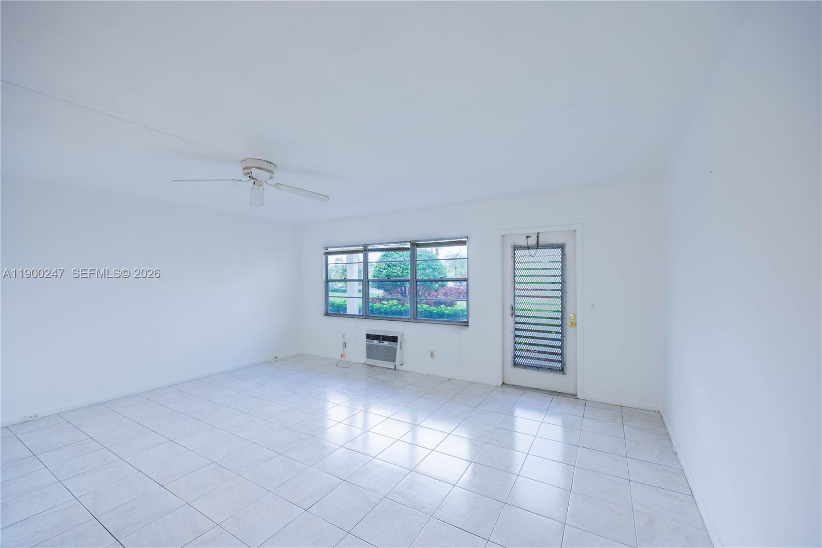 303 Preston H, Unit 303 Boca Raton, FL 33434 - Photo 6 of 50 an empty room with windows
