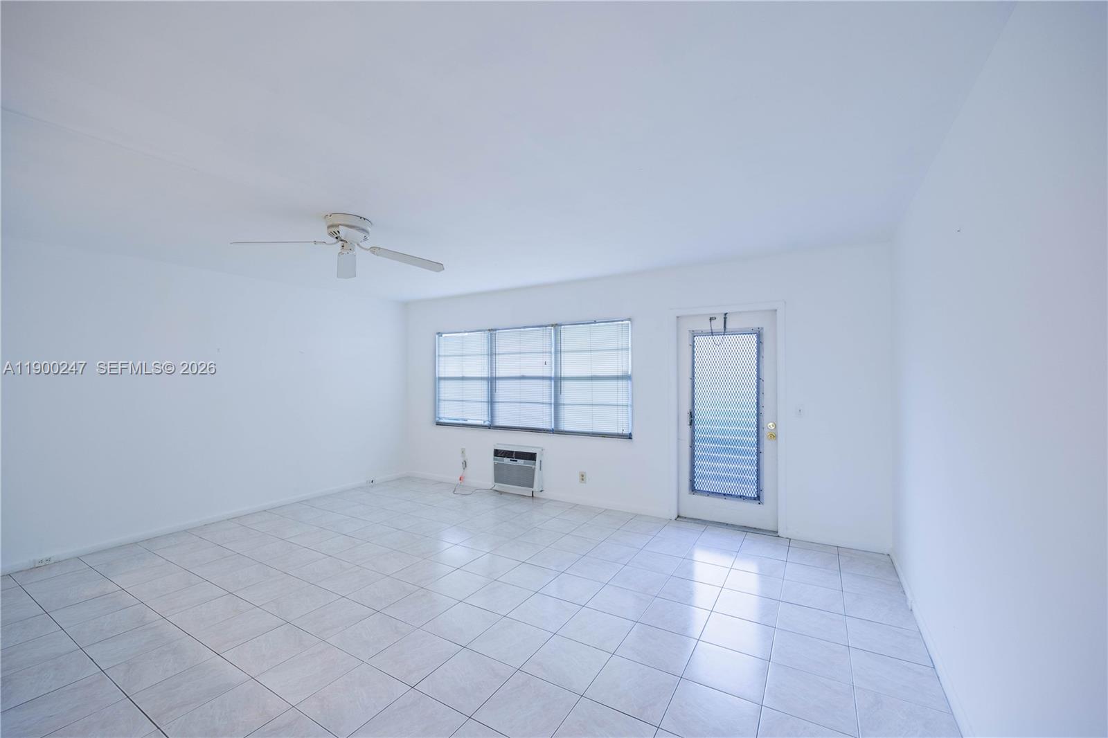 303 Preston H, Unit 303 Boca Raton, FL 33434 - Photo 7 of 50 an empty room with a empty space and windows