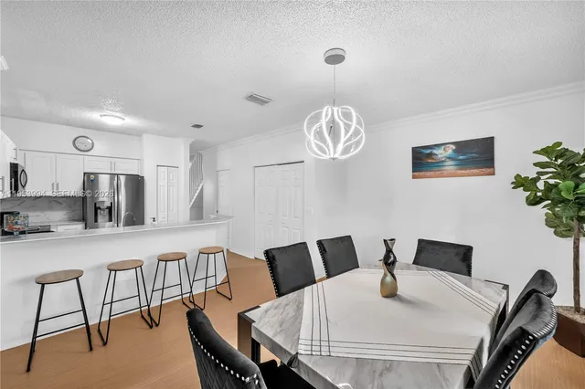 a view of a dining room with furniture
