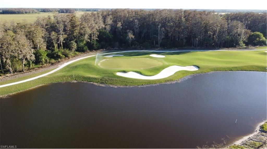 5583 Double Eagle Circle, Unit 4126 Ave Maria, FL 34142 - Photo 25 of 29 a view of a swimming pool and lake view