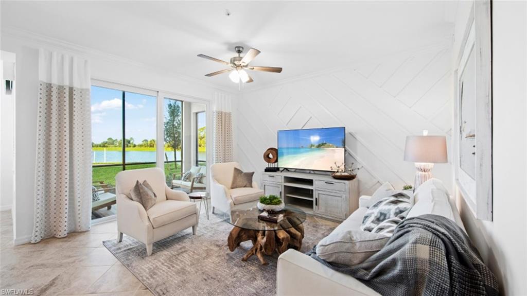 5583 Double Eagle Circle, Unit 4126 Ave Maria, FL 34142 - Photo 8 of 29 a living room with furniture ceiling fan and a window