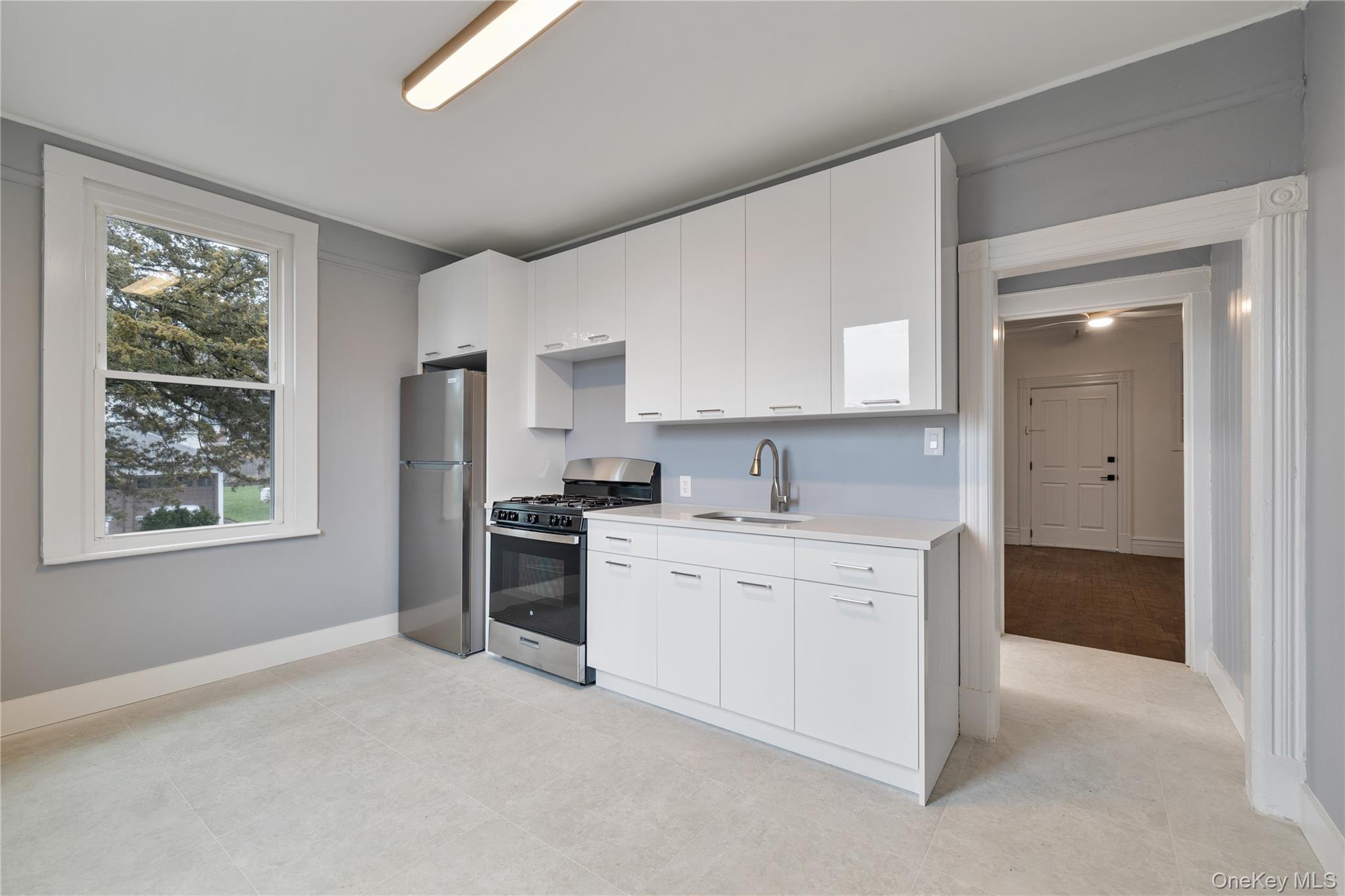 1 Elizabeth Place, Unit 1F Nyack, NY 10960 - Photo 1 of 23 unit 1F:Kitchen with a sink, light countertops, white cabinets, and stainless steel appliances