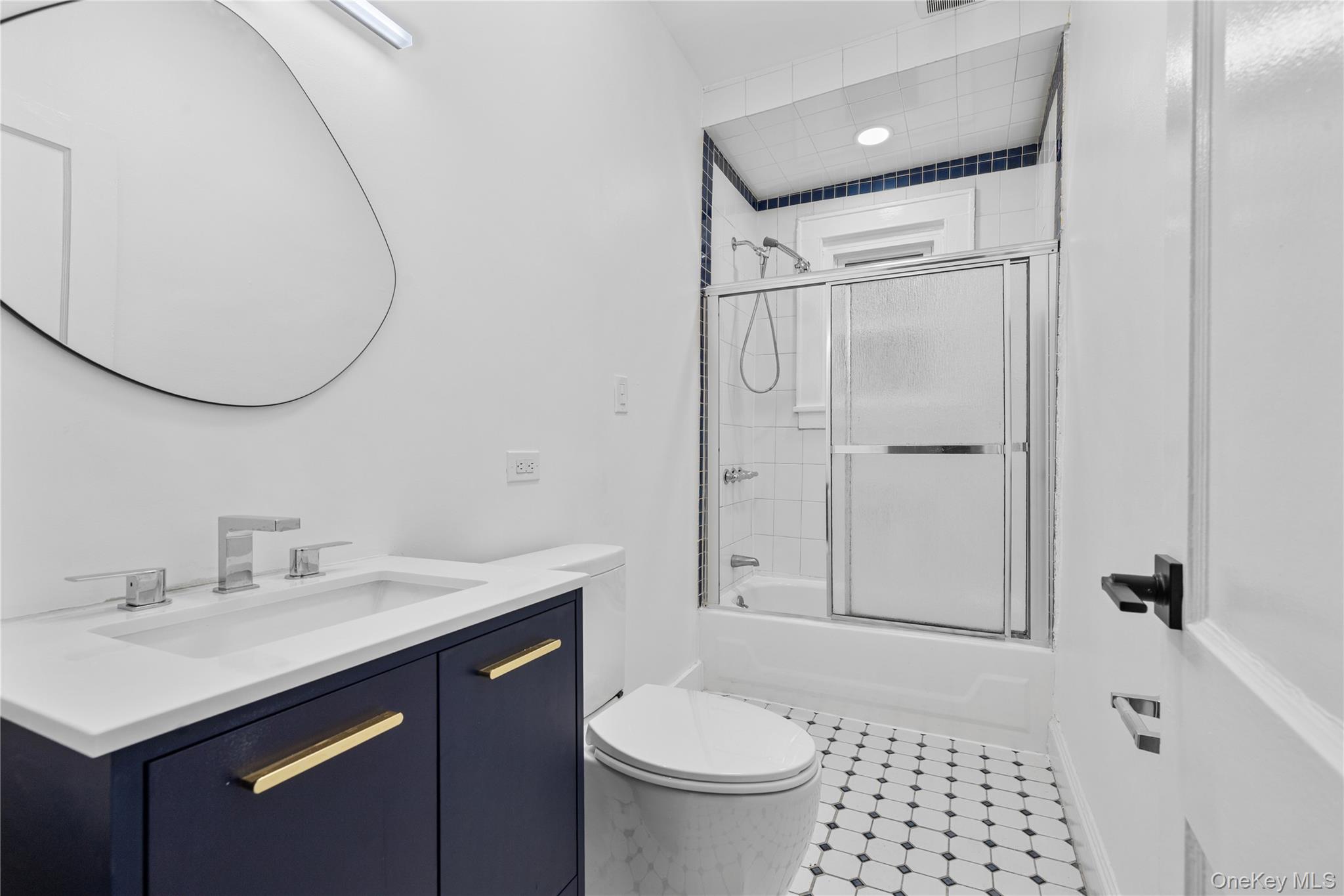 1 Elizabeth Place, Unit 1F Nyack, NY 10960 - Photo 16 of 23 Bathroom with combined bath / shower with glass door, toilet, and vanity