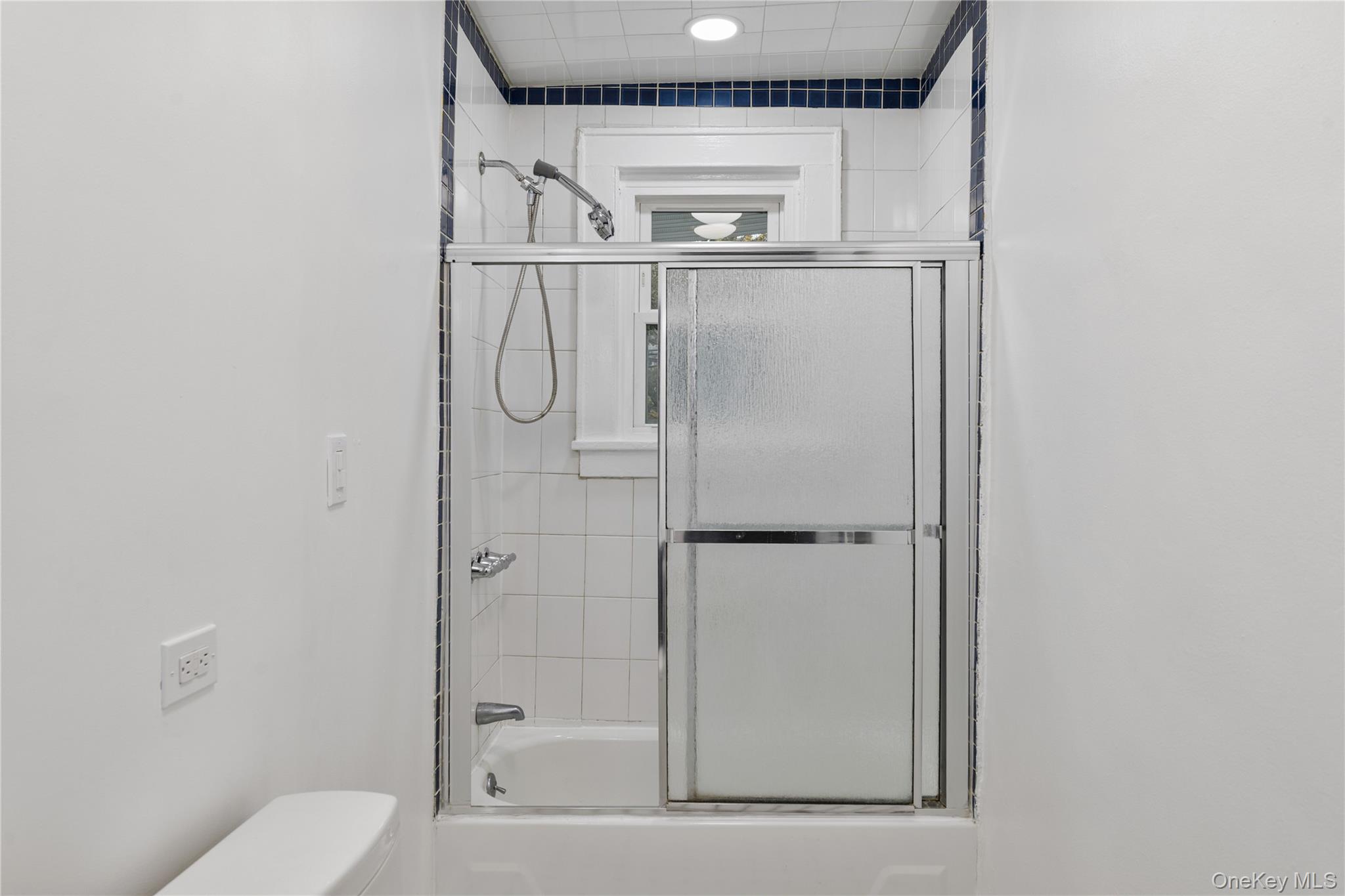 1 Elizabeth Place, Unit 1F Nyack, NY 10960 - Photo 17 of 23 Bathroom with combined bath / shower with glass door and toilet