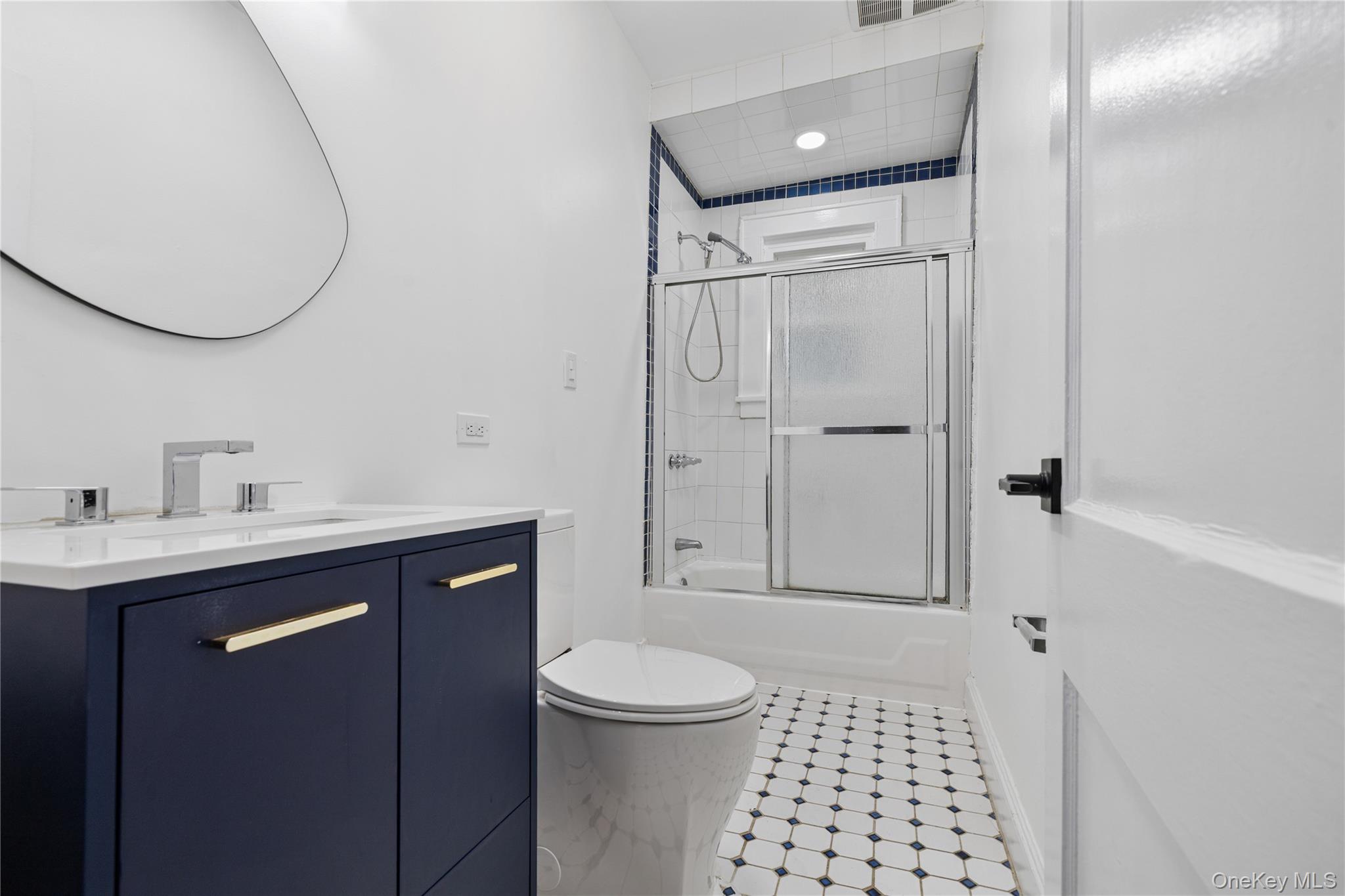 1 Elizabeth Place, Unit 1F Nyack, NY 10960 - Photo 18 of 23 Full bathroom with toilet, shower / bath combination with glass door, vanity, and visible vents