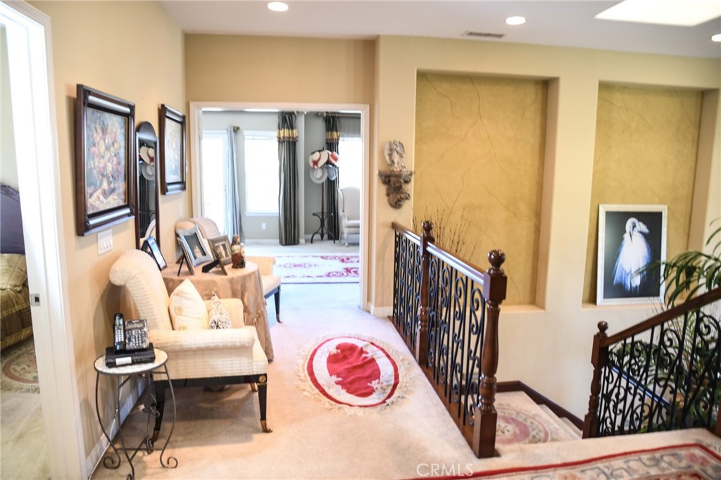 20370 Vía Cellini Porter Ranch, CA 91326 - Photo 11 of 17 a living room with furniture and a table