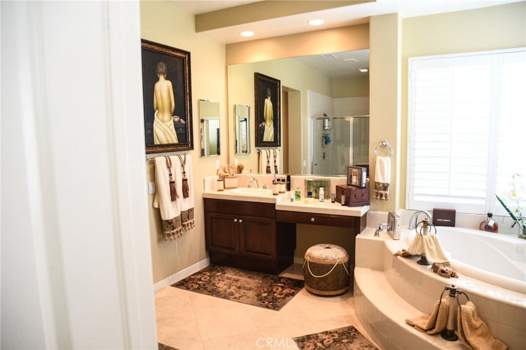 20370 Vía Cellini Porter Ranch, CA 91326 - Photo 13 of 17 a spacious bathroom with a double vanity sink and a mirror