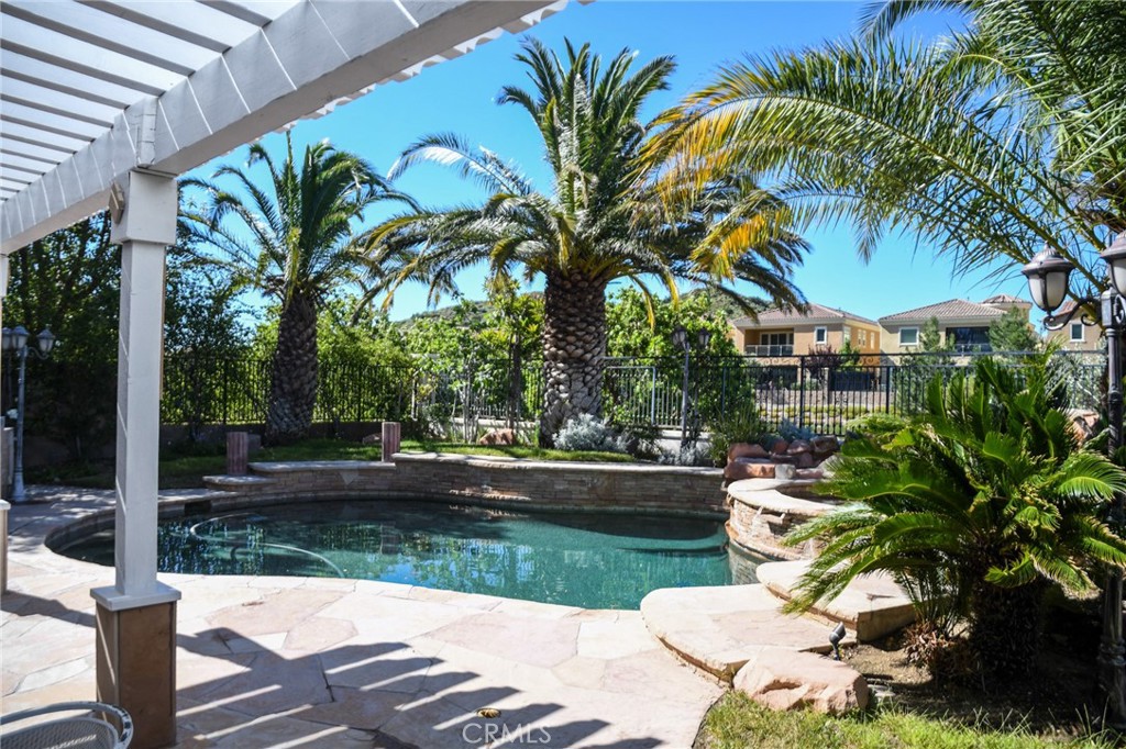 20370 Vía Cellini Porter Ranch, CA 91326 - Photo 16 of 17 a view of a yard with plants and palm trees